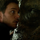 Chris Pratt rubs his face on a T.Rex.